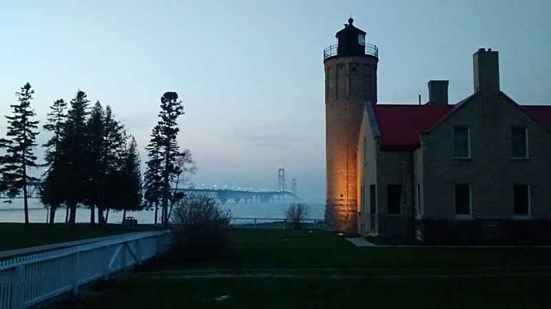 mackinac bridge by the mackinaw point lighthouse